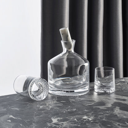 Curated lifestyle setting with the NUDE Glass Alba decanter, tumblers, and elegant bar accessories