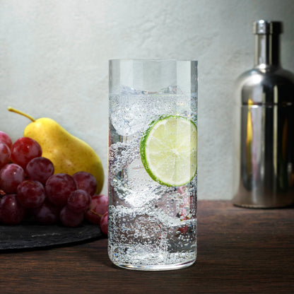 A lifestyle setting featuring the NUDE Finesse Grid crystal glasses arranged on a modern tabletop.