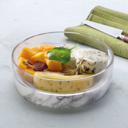 Large Chill bowl on marble base containing ice, styled on a contemporary wooden table