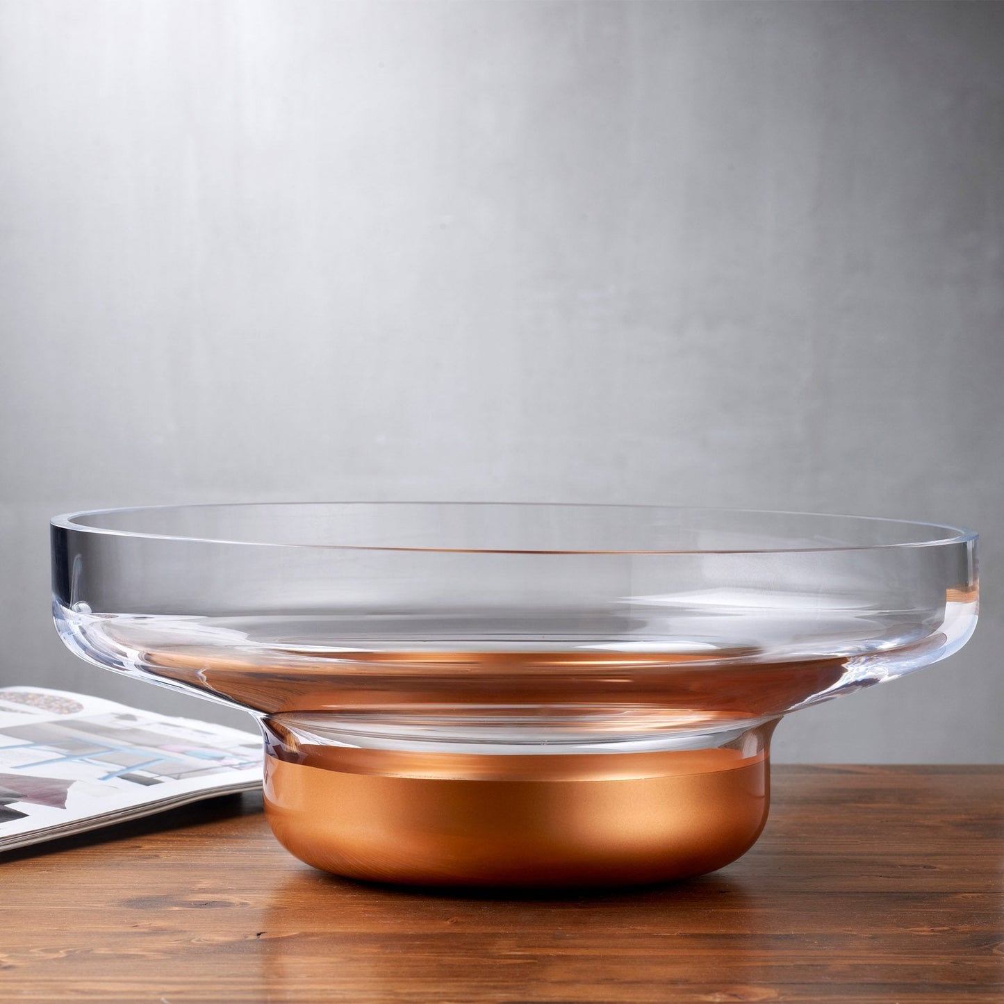 The Contour glass bowl styled with fresh fruit as a table centerpiece in an elegant dining space.