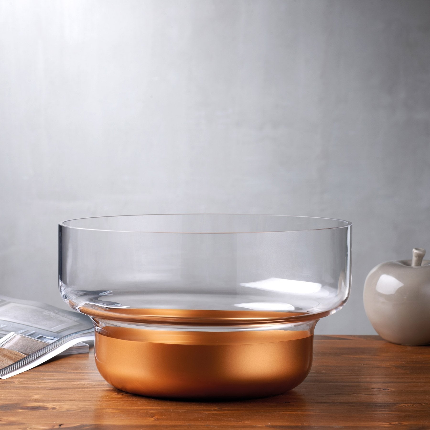 Contemporary NUDE Glass copper contour bowl styled on a polished surface as a chic home decor centerpiece.