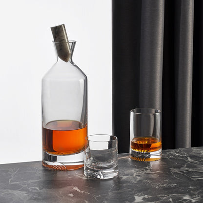 A sophisticated table layout showcasing the crystal Alba carafe and tumblers for entertaining.