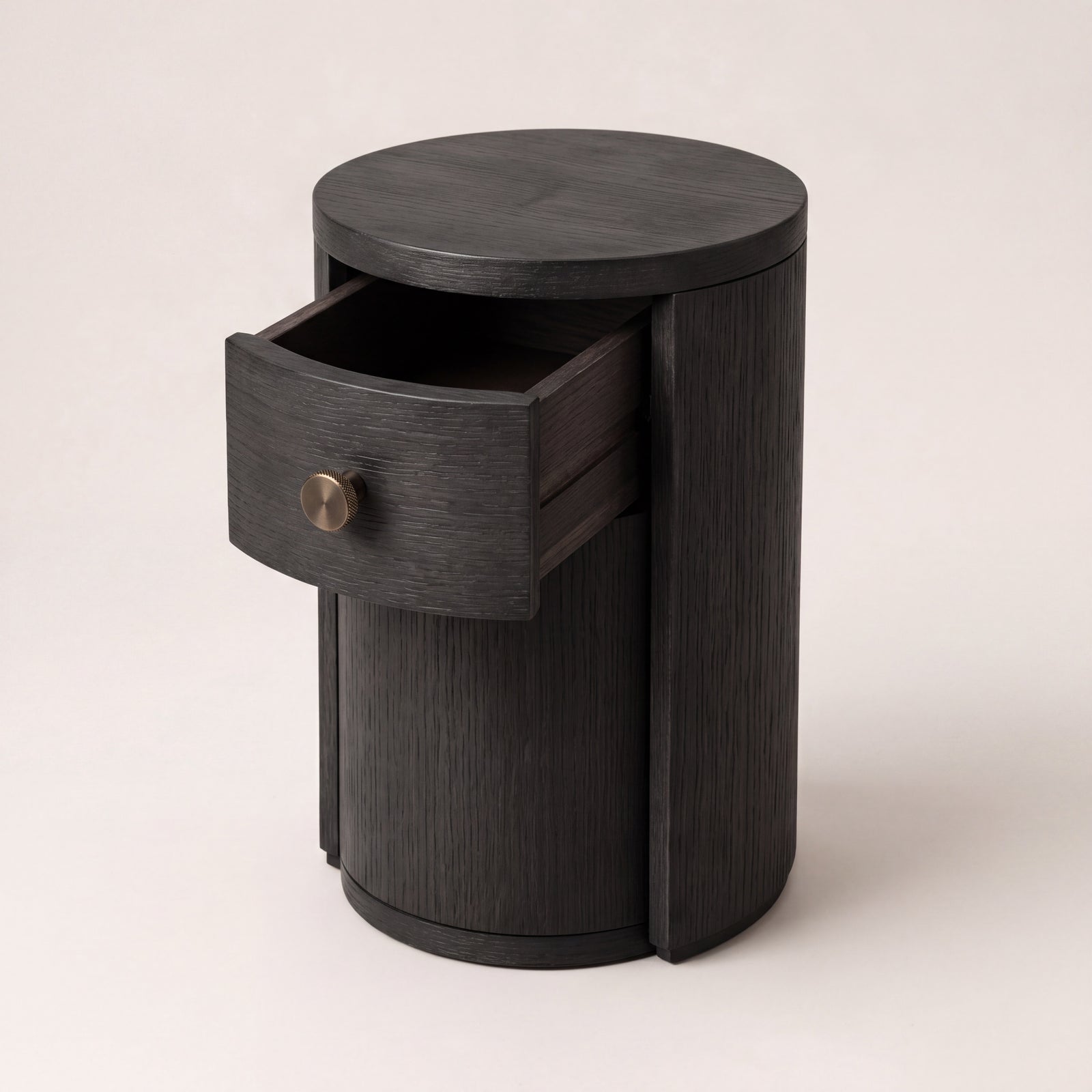 Ebony ash wood nesting table with the lower cabinet door open to reveal a storage drawer.