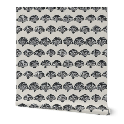 A rolled bolt of The Modern Scallop wallpaper in a sophisticated beige colorway.
