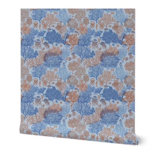 A single roll of Jelly Reef wallpaper in Coastal Blue, featuring a bright cerulean marine motif.