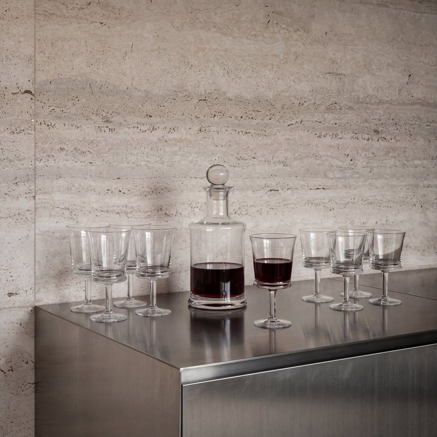 Two NUDE Jour lead-free crystal white wine glasses showing their minimalist design and flared rims.
