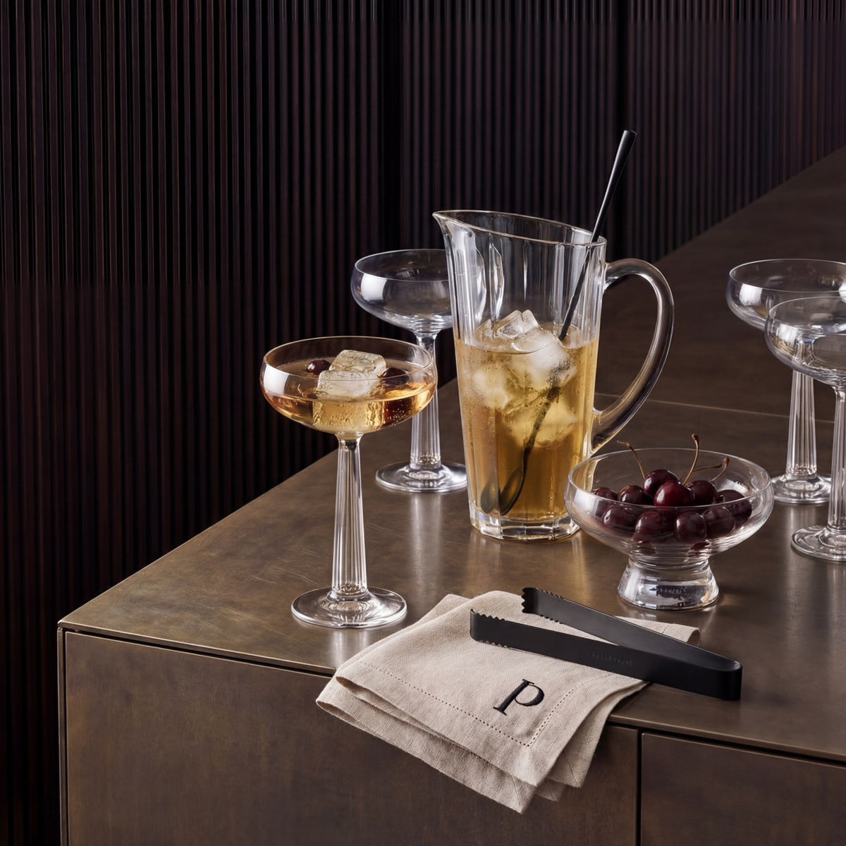 Minimalist NUDE Hemingway crystalline glass jug showcasing its sharp linear pattern and sculptural handle.