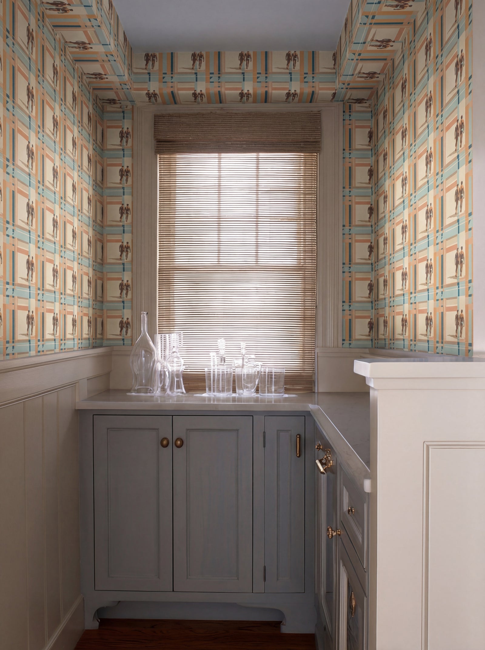 Stylized interior showing the coastal-inspired abstract geometric wallcovering on a living room wall.