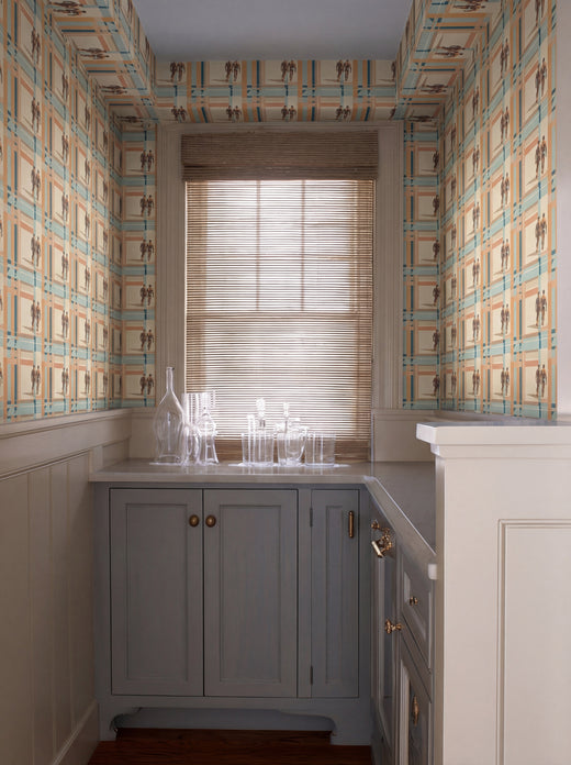 Stylized interior showing the coastal-inspired abstract geometric wallcovering on a living room wall.