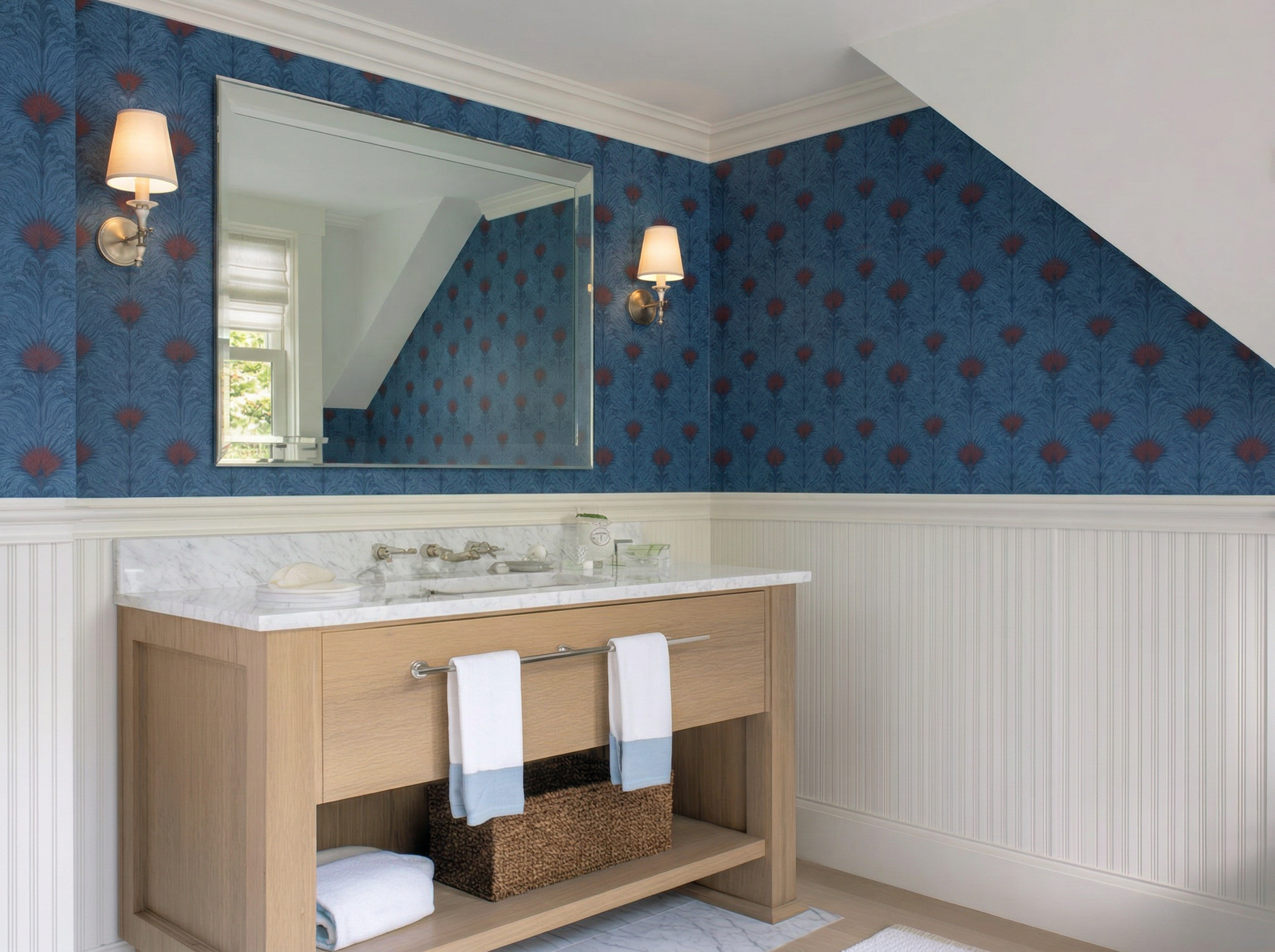 Sea Spray wallpaper showing a fluid blue and white abstract wave pattern on a wall.