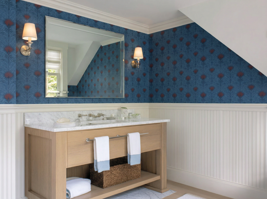 Sea Spray wallpaper showing a fluid blue and white abstract wave pattern on a wall.