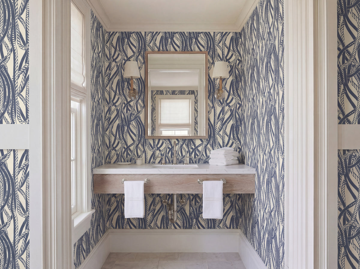 Dockline nautical rope wallpaper in weathered blue-gray on a warm ivory background, styled in a coastal room