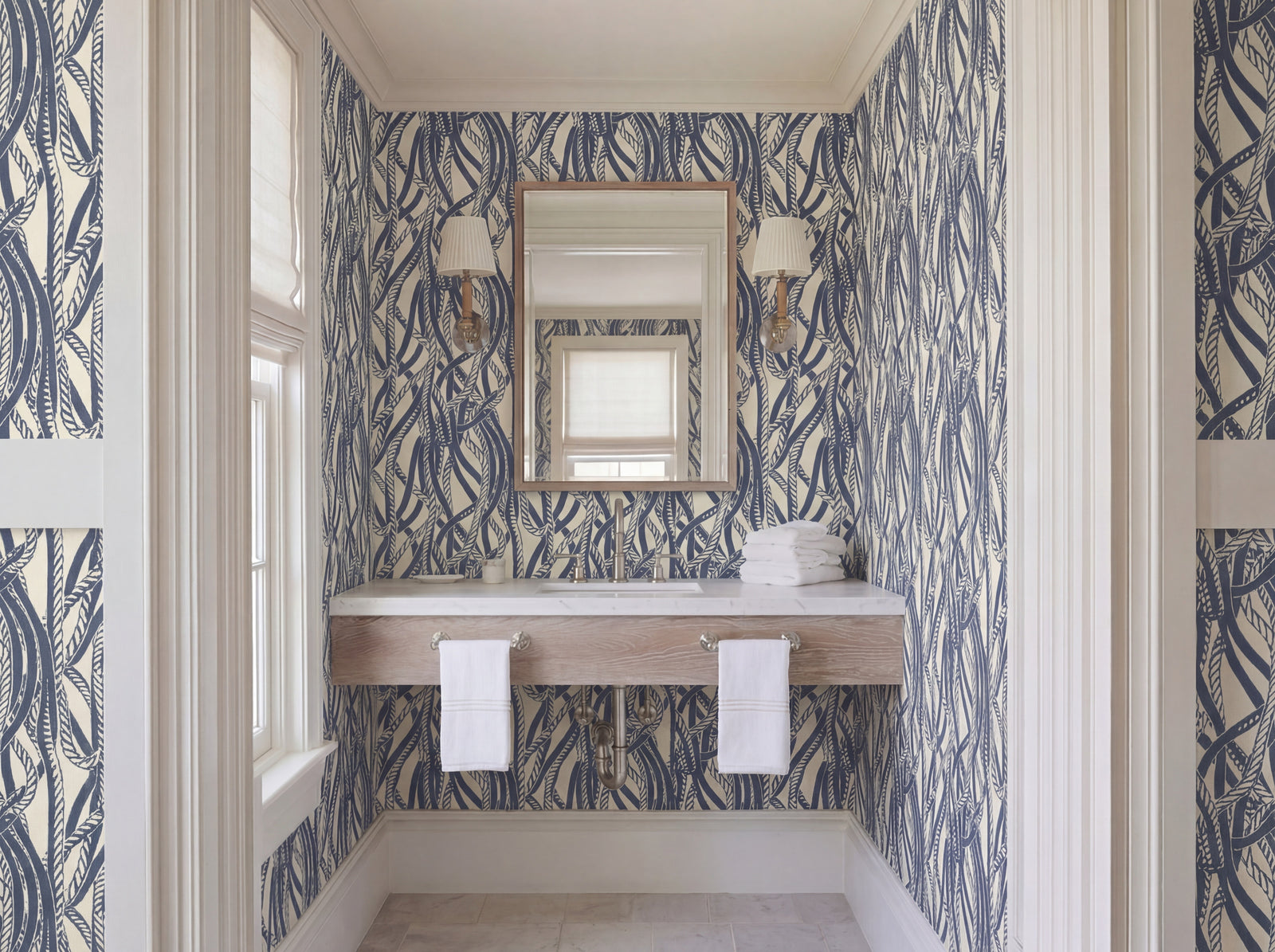 Dockline nautical rope wallpaper in weathered blue-gray on a warm ivory background, styled in a coastal room