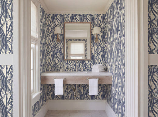 Dockline nautical rope wallpaper in weathered blue-gray on a warm ivory background, styled in a coastal room