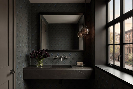 Sophisticated bedroom interior featuring the Midnight Lounge wallpaper behind a modern bed.