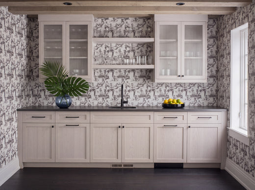 Luxurious bathroom interior accented with custom coastal themed wallpaper.