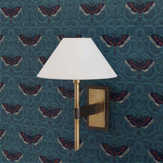 Stylized moth pattern repeat of the Velvet Wings wallpaper in deep teal tones.