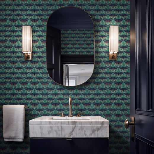 Butterfly Lattice wallpaper in teal installed on a bedroom wall.