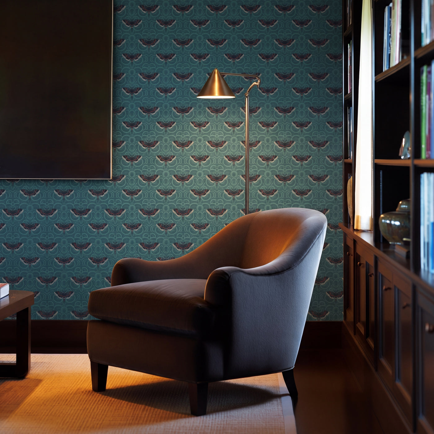 Detail view of the Velvet Wings teal wallpaper showing layered moth patterns with embroidered-style texture.