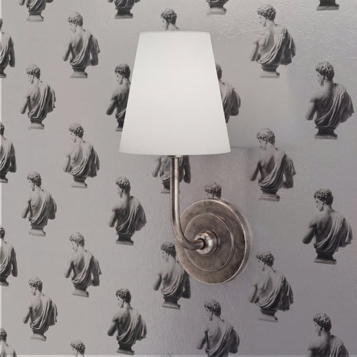 Close-up of the textured classical face pattern on the sculptural Apollo wallpaper
