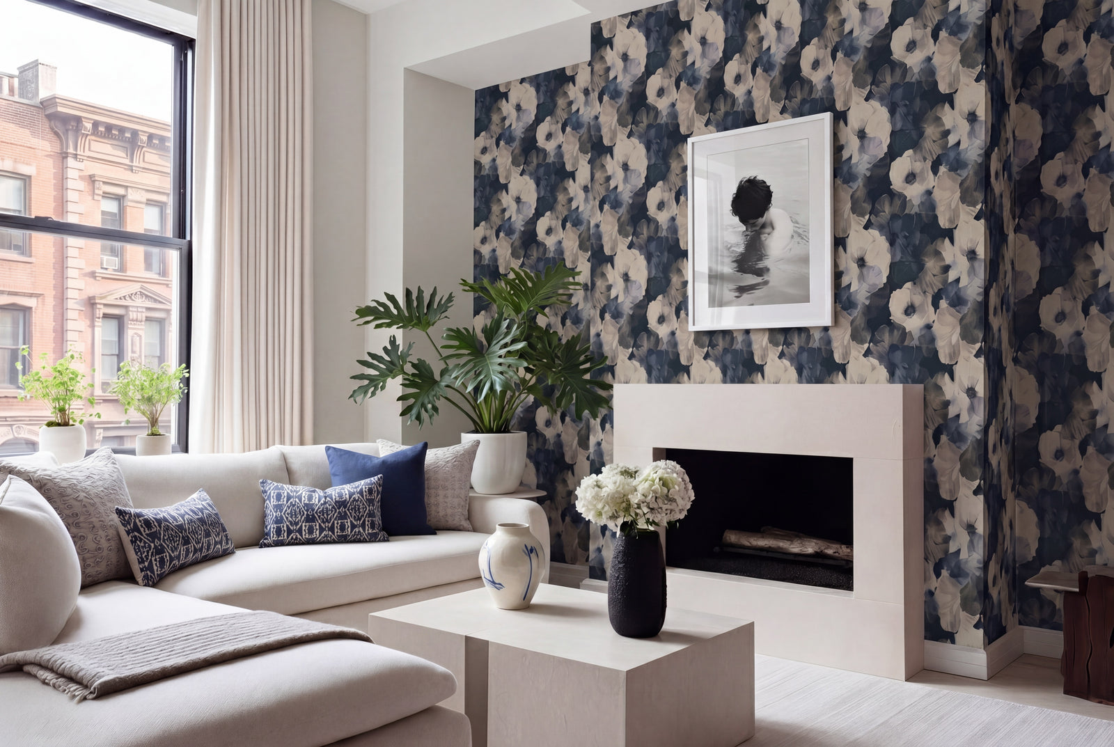 Modern living area featuring Sheer Peonies wallpaper in cool Scandi on an accent wall.
