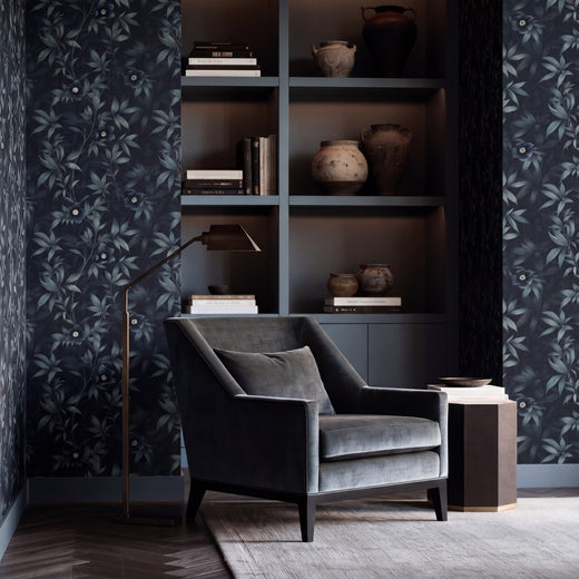 Midnight Bloom Garden wallpaper installed on a moody, sophisticated dining room wall with stylized blue-grey Hellebores.