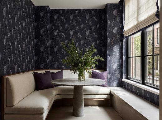 Wisteria and Swallows wallpaper in midnight blue installed in a classic, sophisticated dining room setting