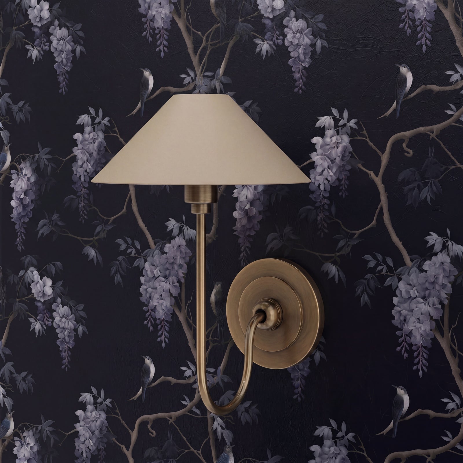 Detail of midnight blue botanical wallpaper featuring lilac wisteria blooms and swallows in a modern bedroom