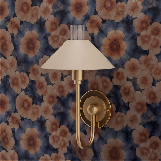 A beautifully decorated room featuring the Sea Poppies botanical wallpaper on a statement wall.