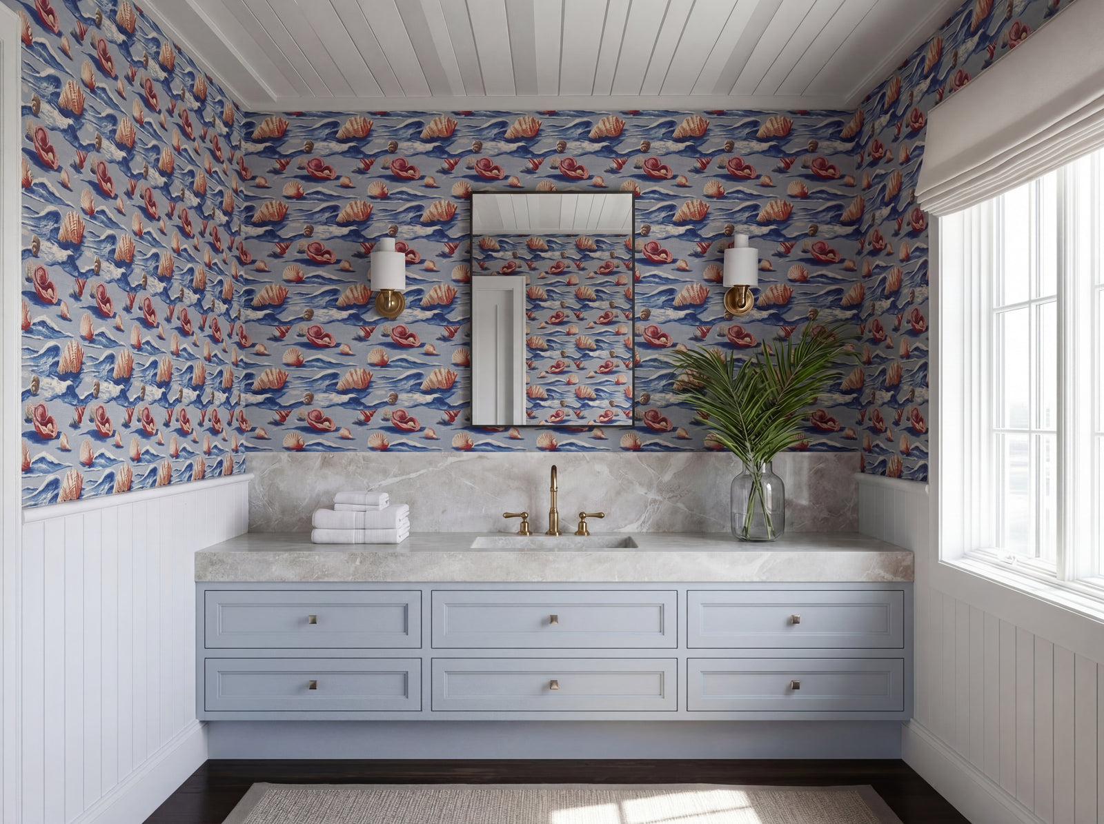 Coastal style bedroom interior styled with custom watercolor seashell patterned wallpaper on the wall.