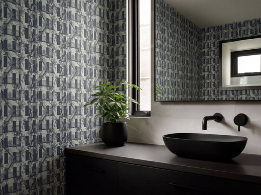 Eclectic Mint colorway of the Greenwich Village narrative wallpaper in a modern creative studio.