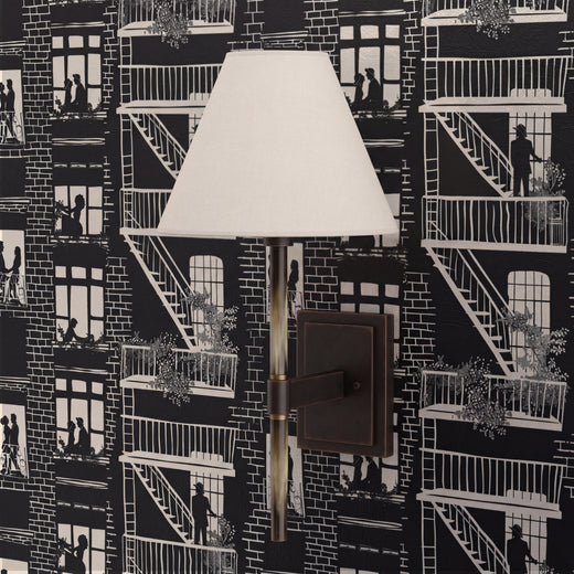 Stylized interior view showcasing black and ivory city toile wallpaper in a modern room setting