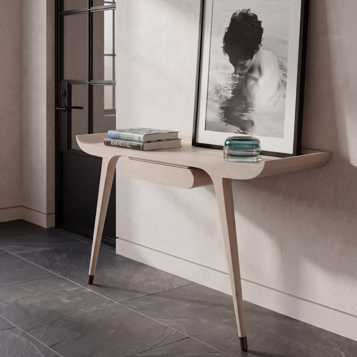 Detailed view of the slim planes and crisp reveals on the floating maple writing desk