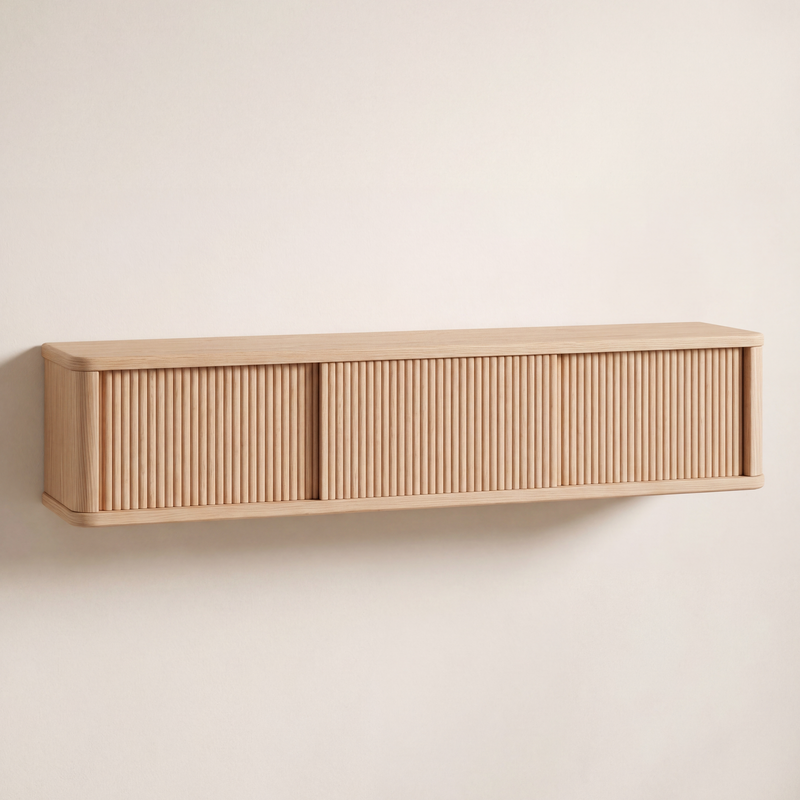 Modern wall-mounted console in natural light wood featuring a sliding tambour door.