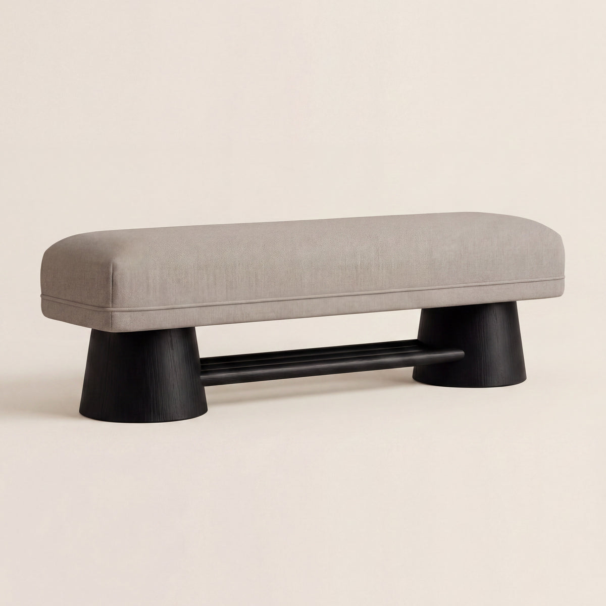 Harbour custom upholstered bench with a matte walnut base, shown in light neutral fabric.