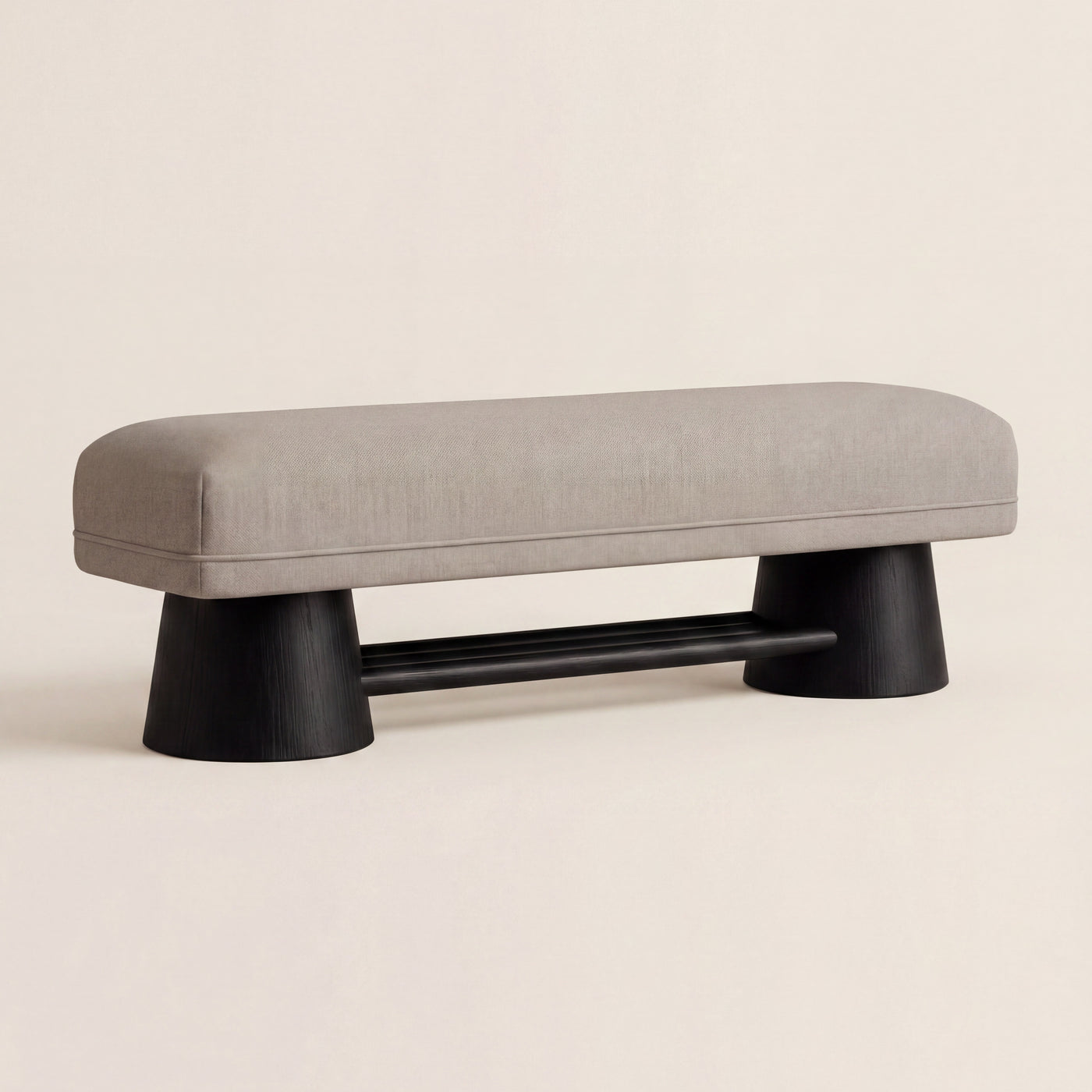Harbour custom upholstered bench with a matte walnut base, shown in light neutral fabric.