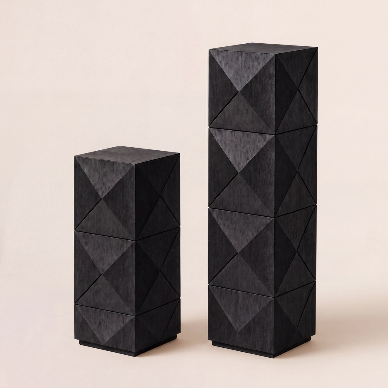 Pair of custom wood display pedestals in short and tall sizes with geometric diamond panels.