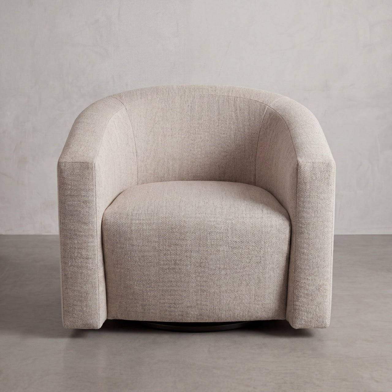 Side profile of the Floating Lounge Chair highlighting the sculptural curved back and grounded frame.