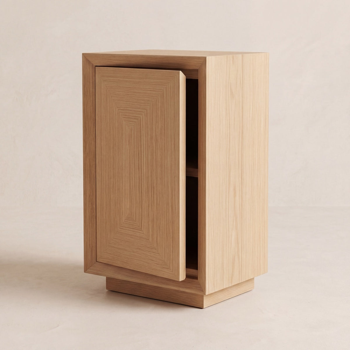 Studio Side Table in oak with a push-to-open cabinet door partially revealed.