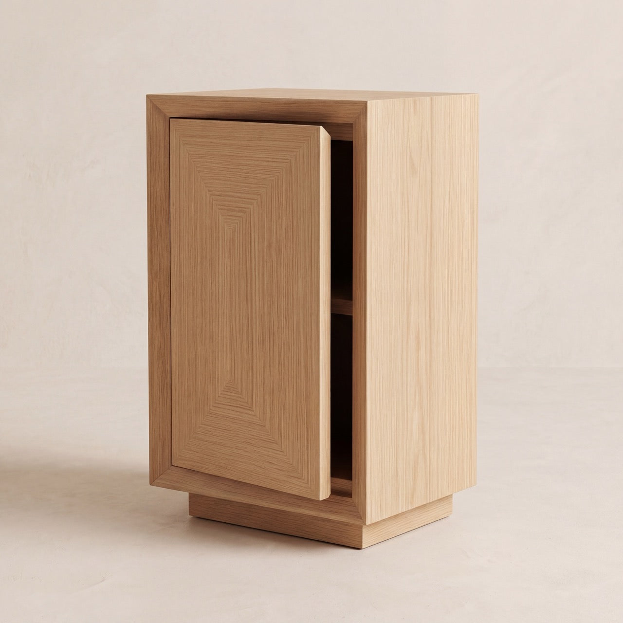 Studio Side Table in oak with a push-to-open cabinet door partially revealed.