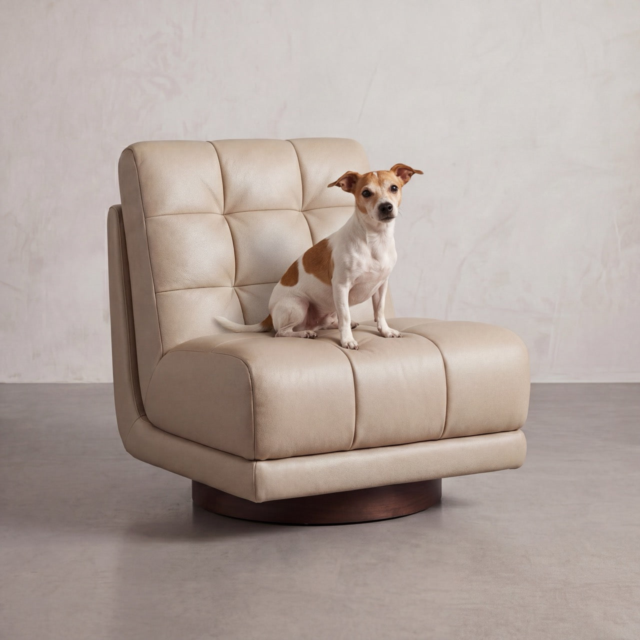 The Puffer swivel lounge chair styled in a refined residential living room corner.