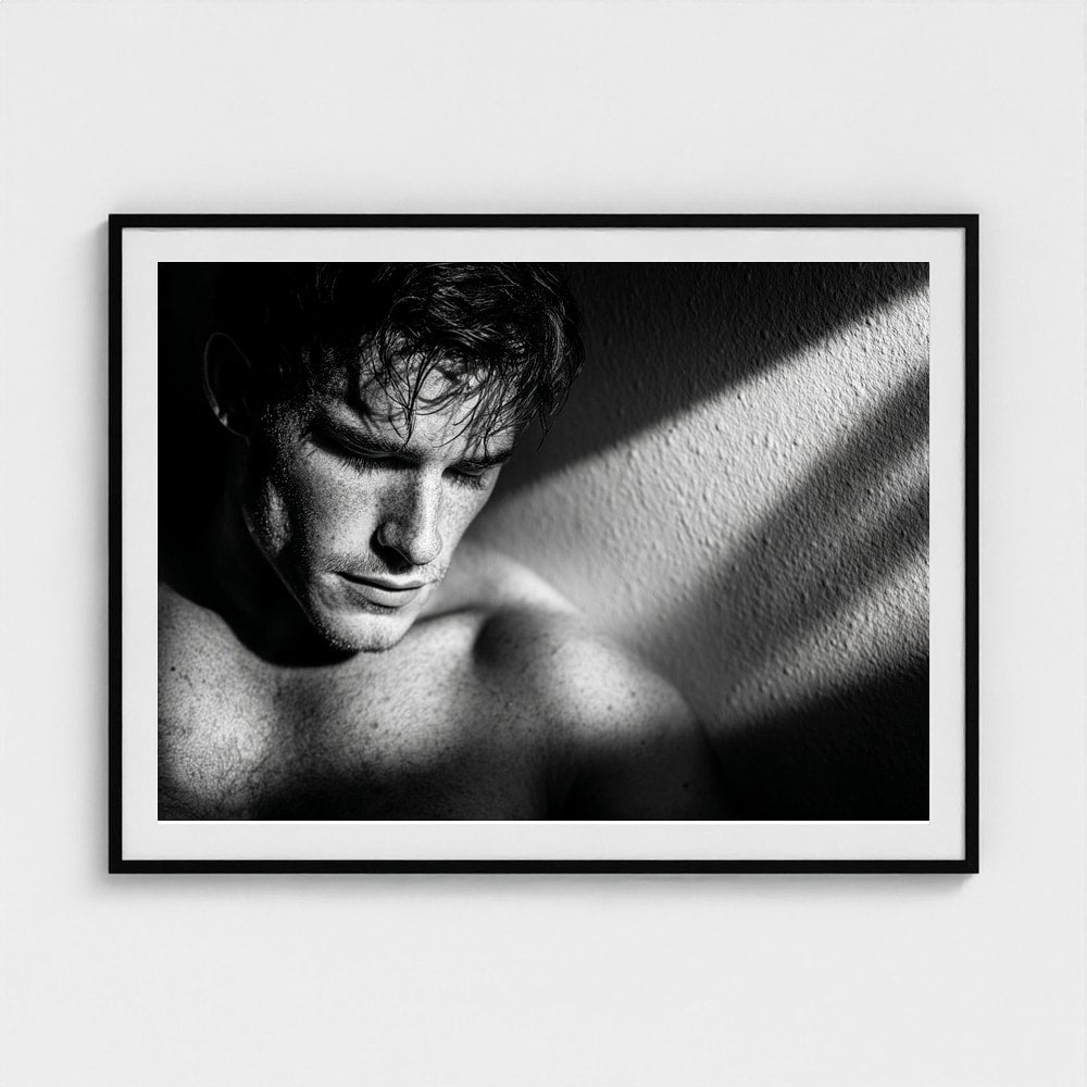 Contemplative Masculine Portrait in Grayscale Light