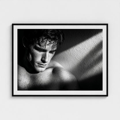 Contemplative Masculine Portrait in Grayscale Light