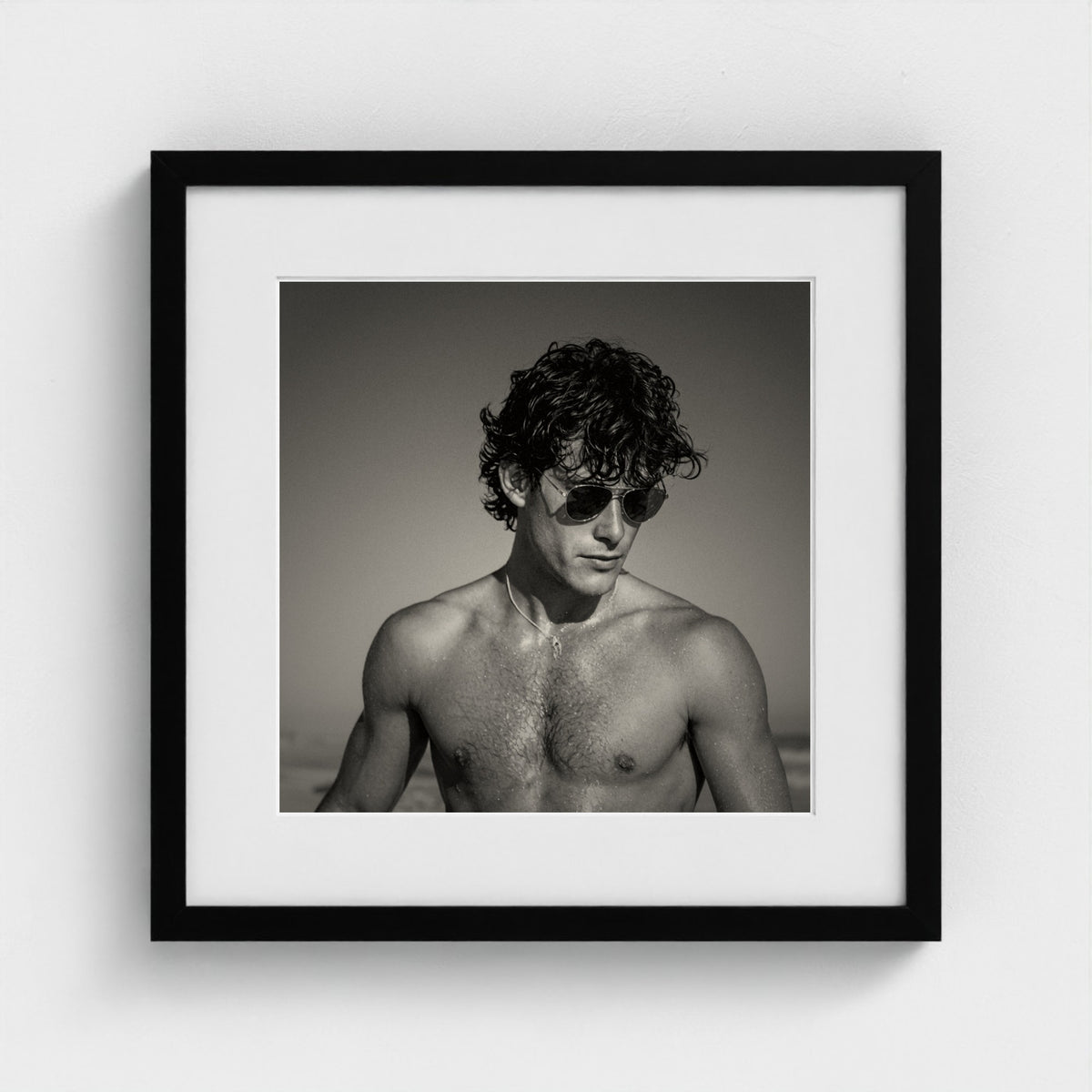 Monochrome portrait study art print in a minimalist 16x16 inch black wood frame.