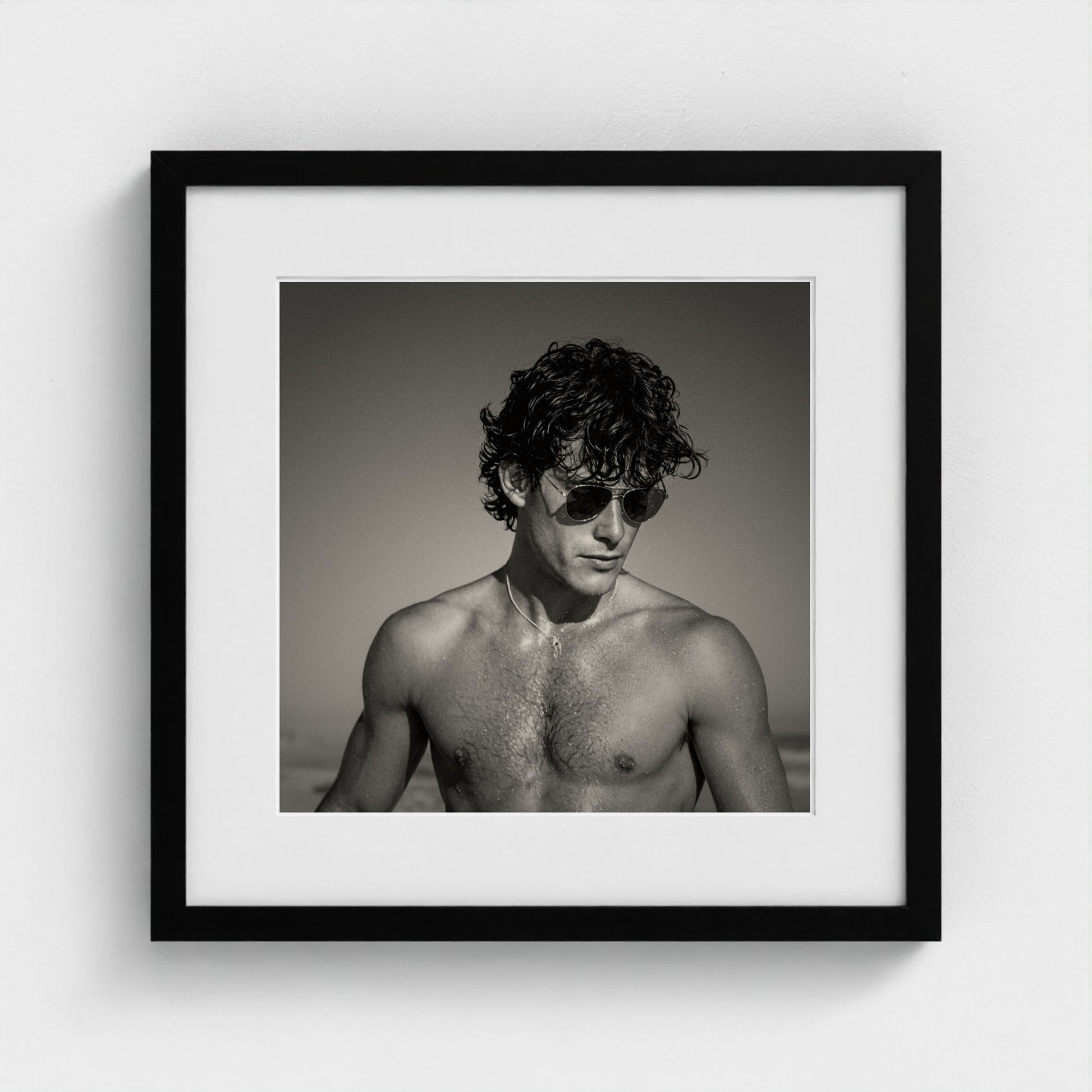 Monochrome portrait study art print in a minimalist 16x16 inch black wood frame.