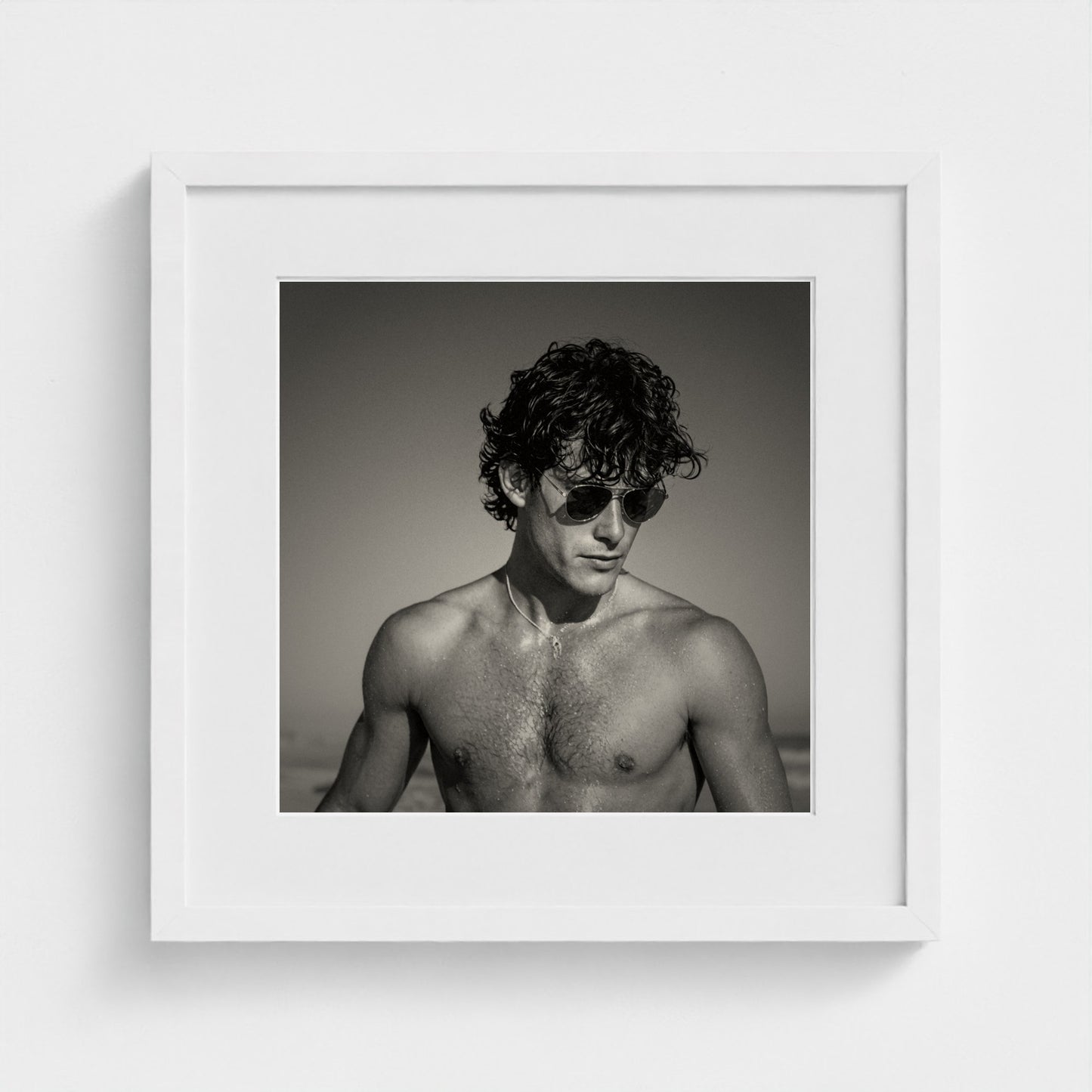 Minimalist monochrome portrait print in a 16x16 inch gallery-style white frame.