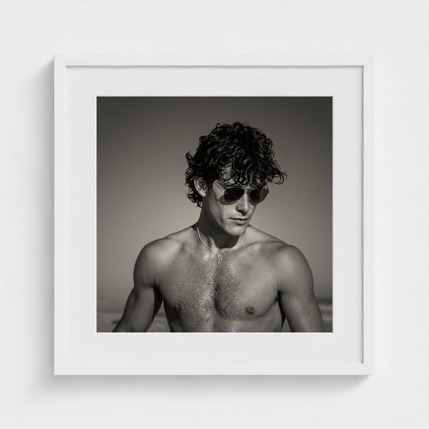 A 20x20 inch elegant black and white portrait art print beautifully finished in a white frame.