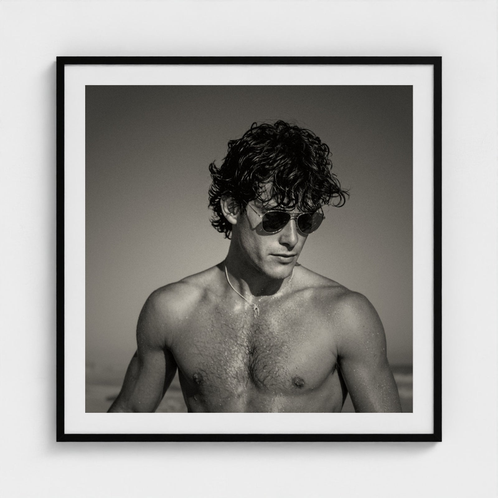 The Coastal Gaze portrait print displayed in a 36x36 inch black frame on a gallery wall.