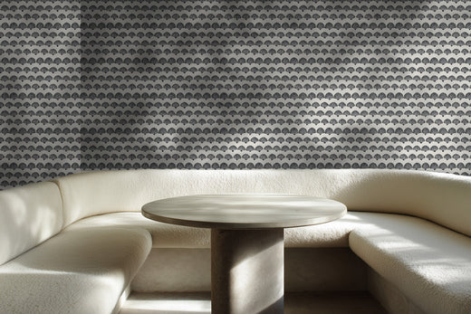 Beige geometric scallop wallpaper accenting a cozy and bright breakfast nook.