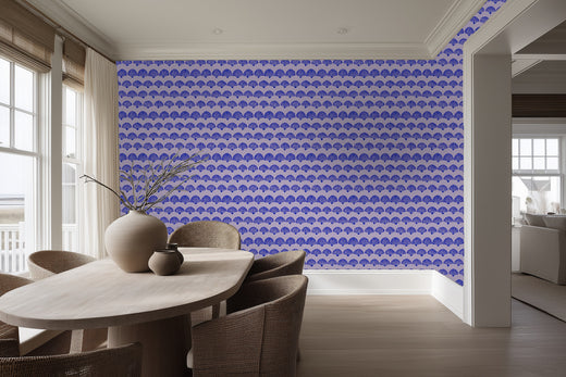 Detailed view of the purple scallop patterned wallpaper in a chic dining space.